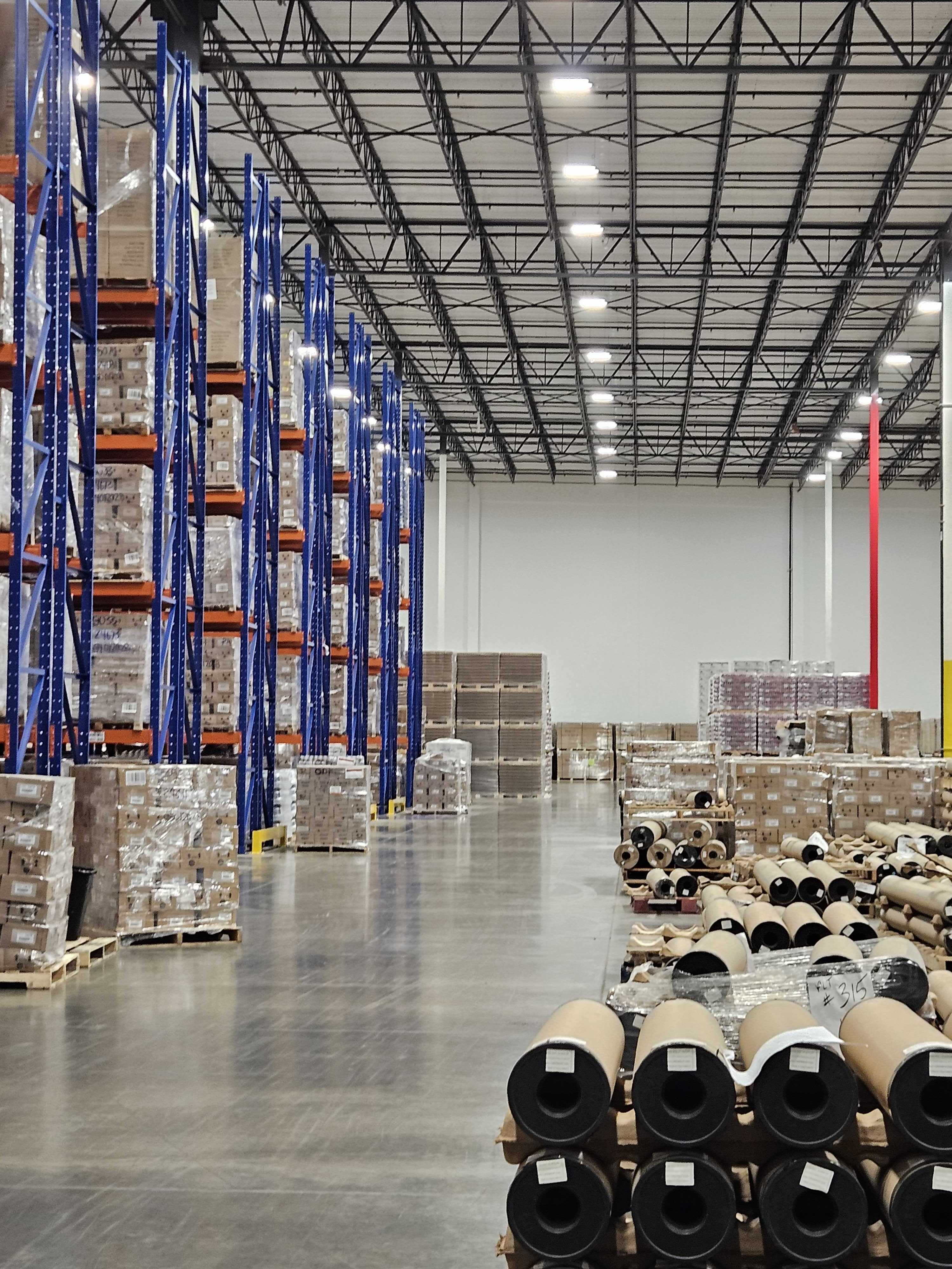 Warehouse aisles with tall inventory racks