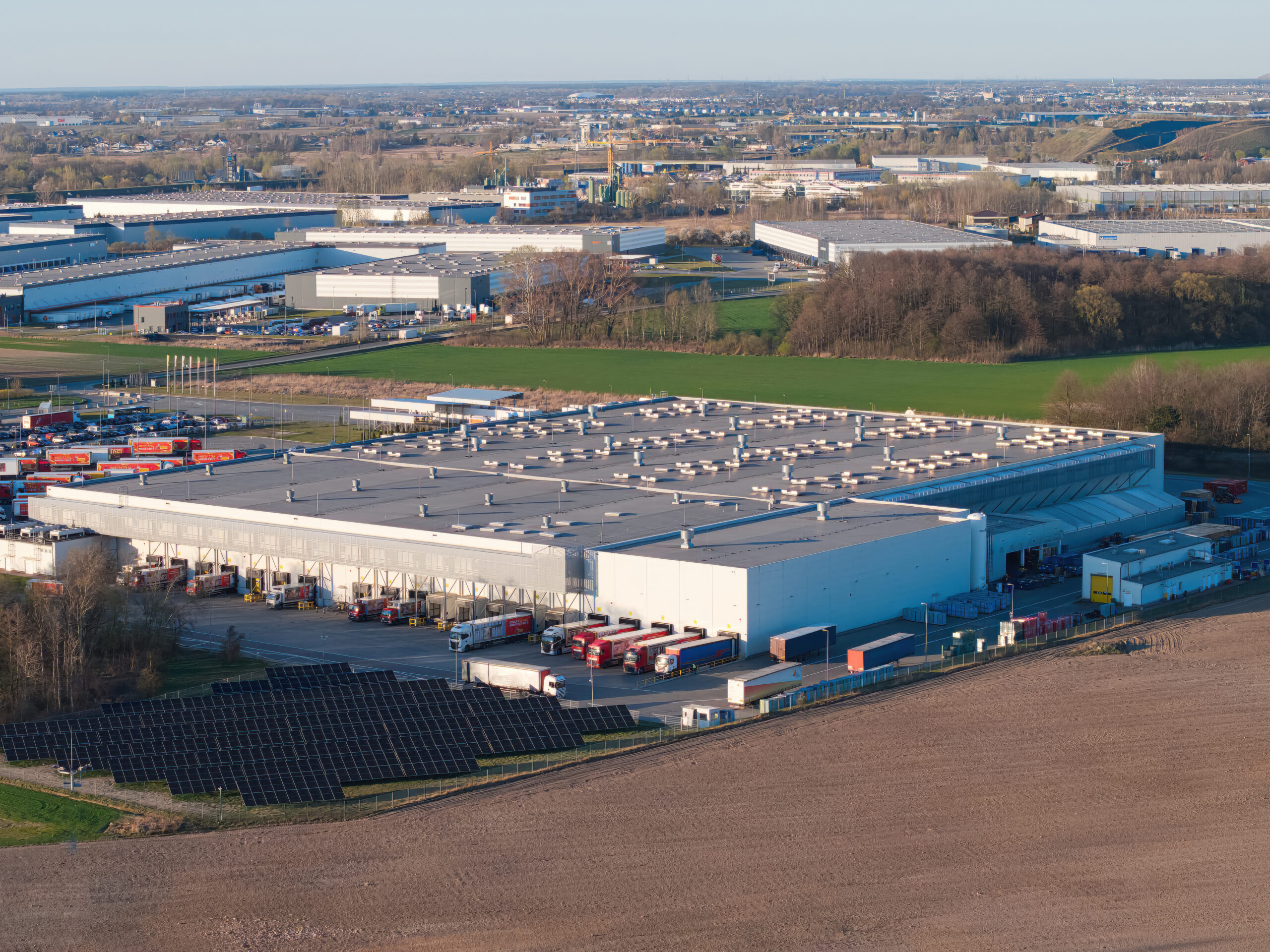 Apogee 180MP drone view of a logistics center in early spring, illustrating the concept of supply chain, logistics, and international trade.