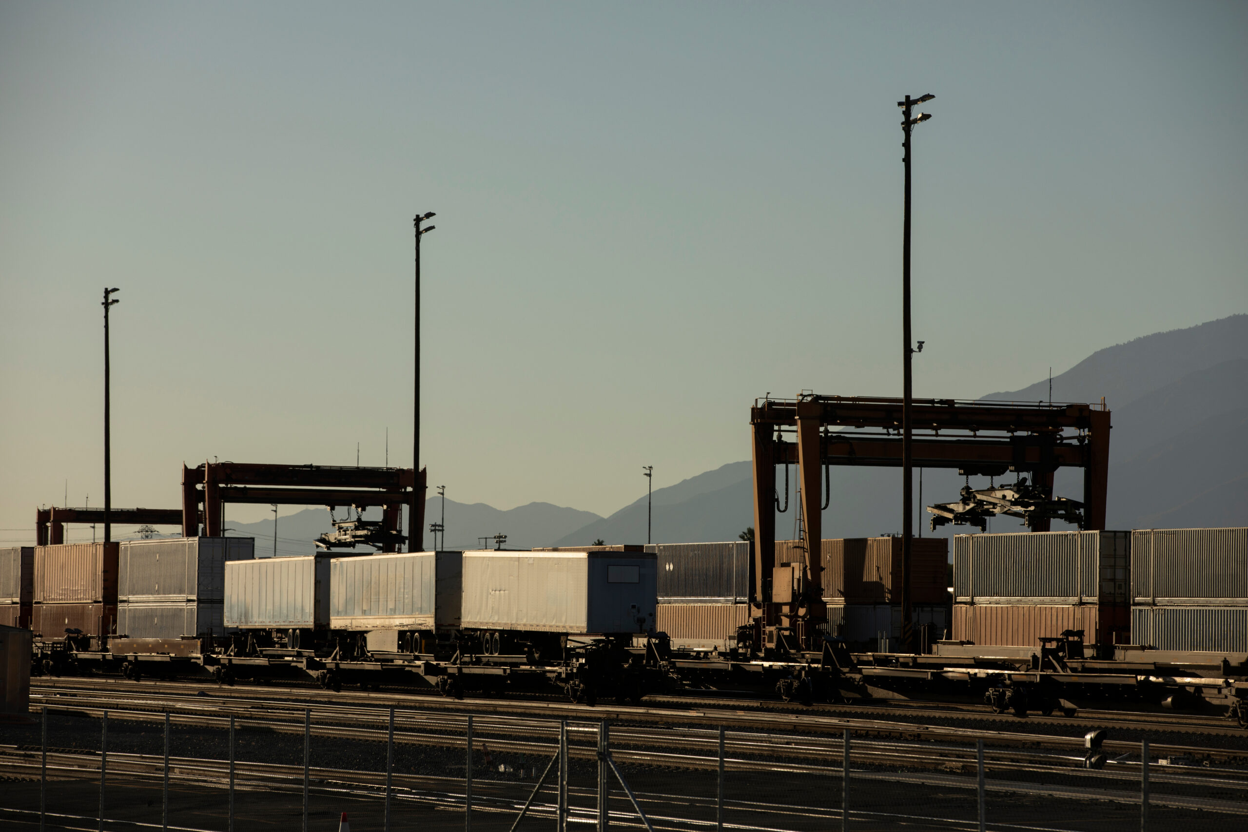 Apogee 180MP san bernardino, california, usa october 10, 2021: a late afternoon cargo stack train arrives at an intermodal facility to be unloaded.
